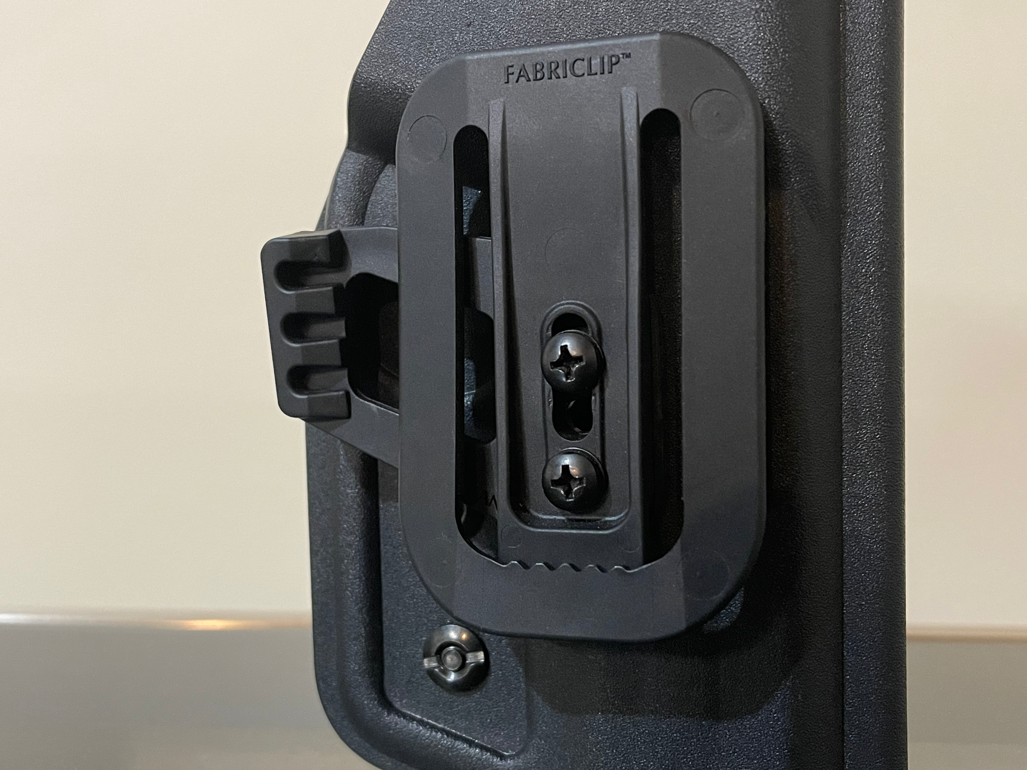 Fabriclip with concealment wing